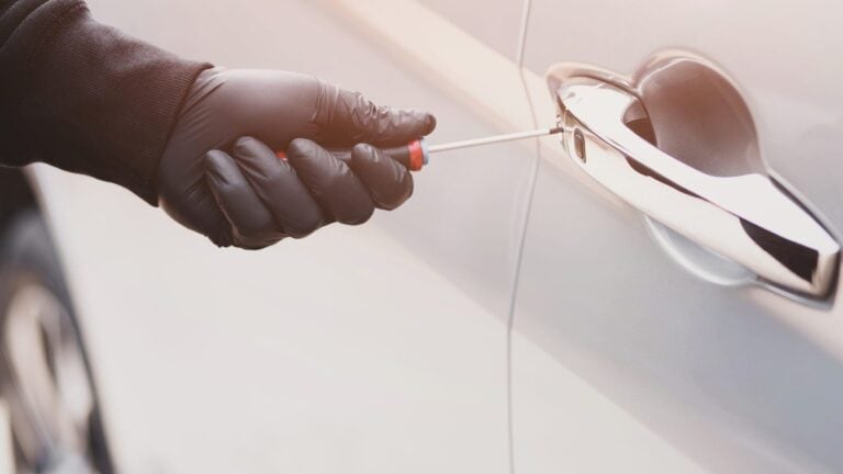 Remote Vehicle Immobilization, GPS vehicle lock being accessed with a screwdriver, security system for vehicle protection.