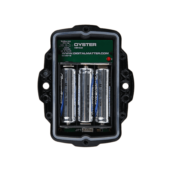 4. Internal view of a GPS tracker device with batteries and circuit board, used for vehicle tracking and fleet management.