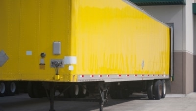 Yellow delivery truck with GPS tracking system installed.